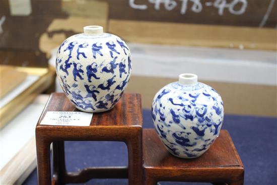 Two Chinese crackleglaze small blue and white vases, painted with figures, late 19th century plus wood scholars stand tallest 7cm